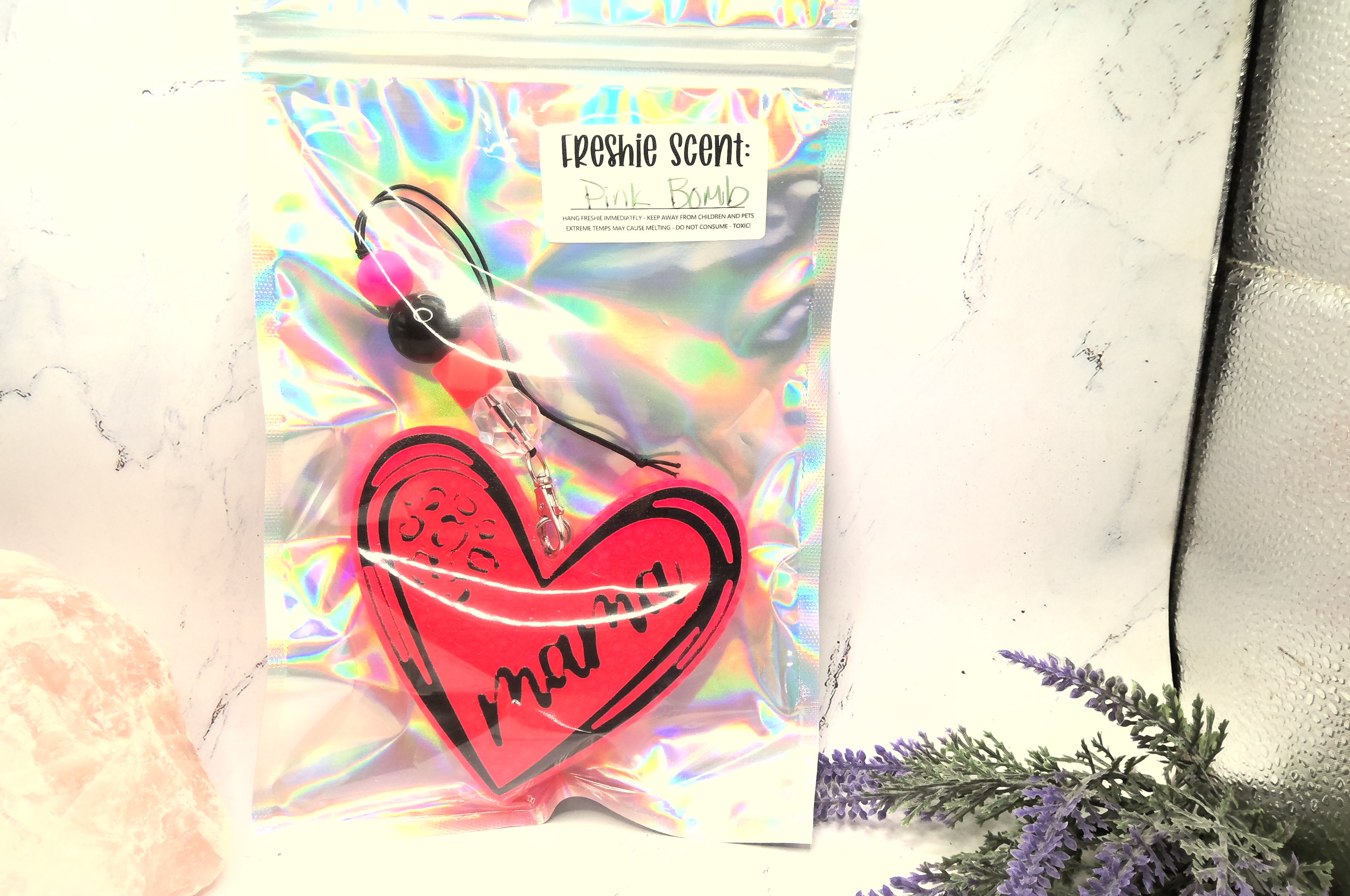 Heart-shaped Car Freshie with mama with a holographic bag.